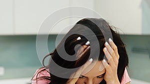 Young woman working at home during quarantine. Joyful posiitve smiling call center empliyee finishing work and take