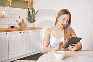 Young woman working indoors. Home vacation portrait. Blogger. Alone in interior