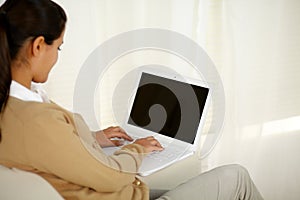 Young woman working on laptop computer