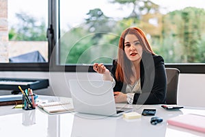 Young woman working on a laptop from home