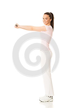 Young woman working out with dumbbells