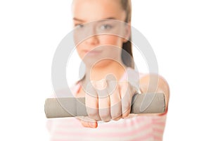 Young woman working out with dumbbells