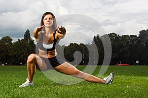 Young woman working out in a park