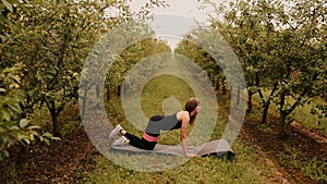 young woman working out Resistance bands in sportswear outdoors