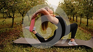 young woman working out Resistance bands in sportswear outdoors