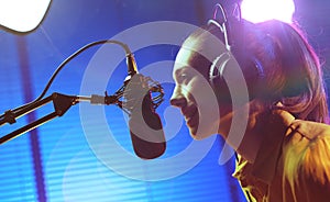 Young woman working at the radio broadcasting station