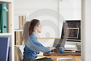 Young Woman Working in Software Development Studio