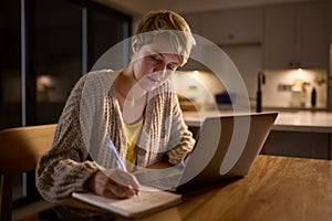 Young Woman Working Or Studying On Laptop At Home At Night