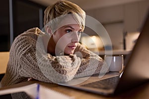 Young Woman Working Or Studying On Laptop At Home At Night Staring At Screen