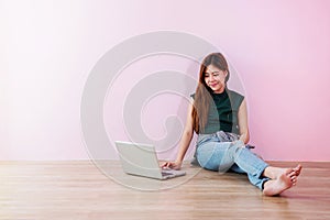 Young Woman Working or Studying on Laptop, Sit on the Floor and