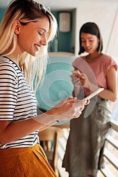 Young woman working with tablet in office. People digital device business education concept