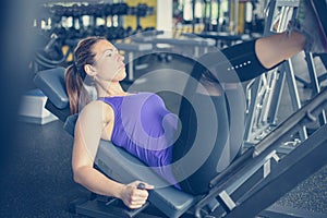 Young woman workout in gym.