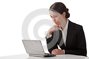 The young woman works on a computer