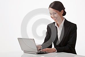 The young woman works on a computer