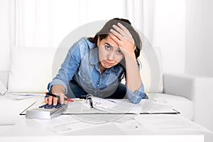 Young woman worried at home in stress accounting desperate in financial problems