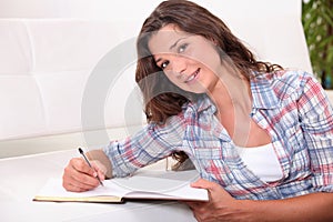 Young woman writing