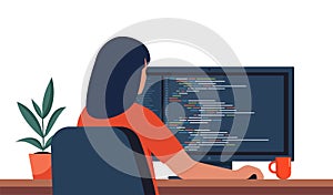 Young woman writing code on a desktop computer. Software developer at work. Programming coding script java, digital program code