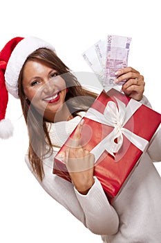 Young woman with an Xmas gift and money