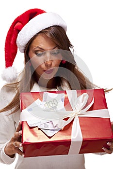 Young woman with an Xmas gift and money