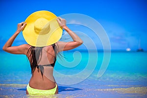 Young woman in yellow hat during caribbean