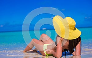 Young woman in yellow hat during caribbean