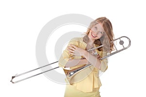 Young woman in yellow mini dress holding trombone