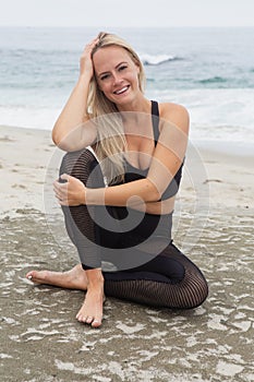 Young woman yoga at the beach