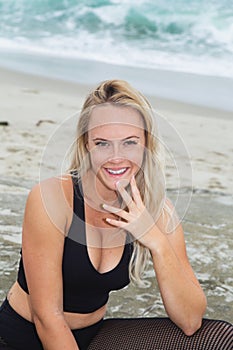 Young woman yoga at the beach