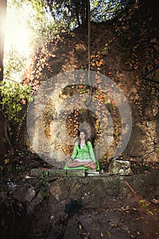 Young woman in yoga meditation outdoor