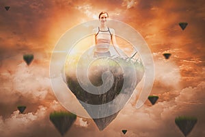 Young woman in yoga and meditation sitting on fantasy island floating in air,to refresh the mind and spirit, sunset background,