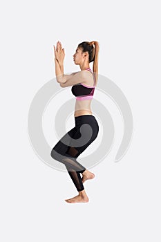 Young woman in yoga pose.