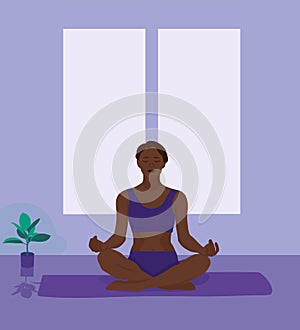 A young woman in Yoga pose on blue background. Relax and meditate. Healthy lifestyle. Balance training. Women silhouette.