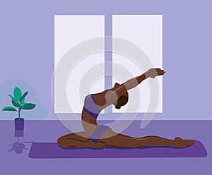 A young woman in Yoga pose on blue background. Relax and meditate. Healthy lifestyle. Balance training. Women silhouette.