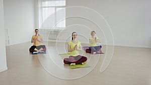 Young woman during the yoga traning relaxing