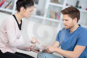 Young woman bandage boyfriend wrist