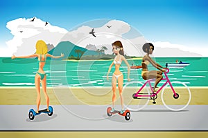 Young women in bikini ride gyroscopes and bicycles