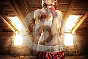 Young women boxing, exercise in the attic