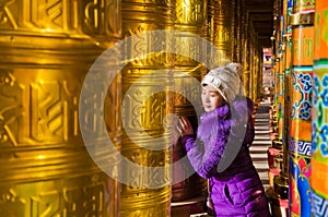 Young women and Buddhist Prayer Wheels