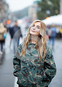 Young women in camouflage jacket