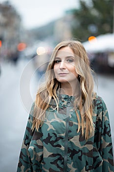 Young women in camouflage jacket