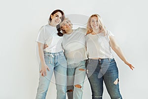 Young women in casual clothes having fun together. Bodypositive concept.