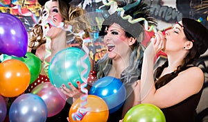 Young women celebrating German fasching Carnival at Rose Monday