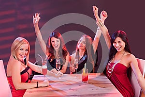 Young women celebrating in a nightclub