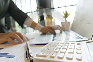 Young women are checking the company`s finances to prepare business development