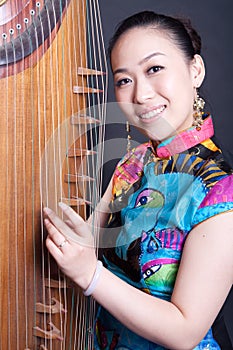 Young women and Chinese zither photo