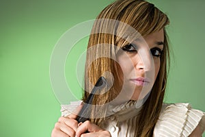 Young women combing her hair