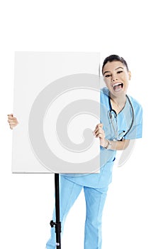 Young women doctor writing on whiteboard.