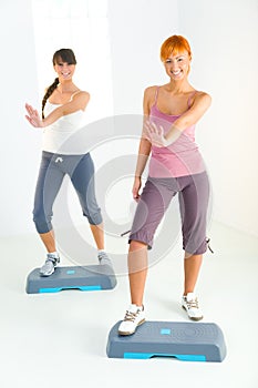 Young women doing fitness exercise