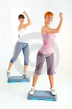 Young women doing fitness exercise