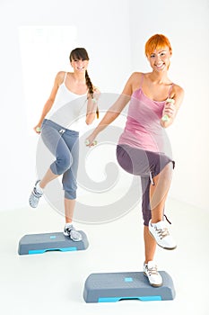 Young women doing fitness exercise